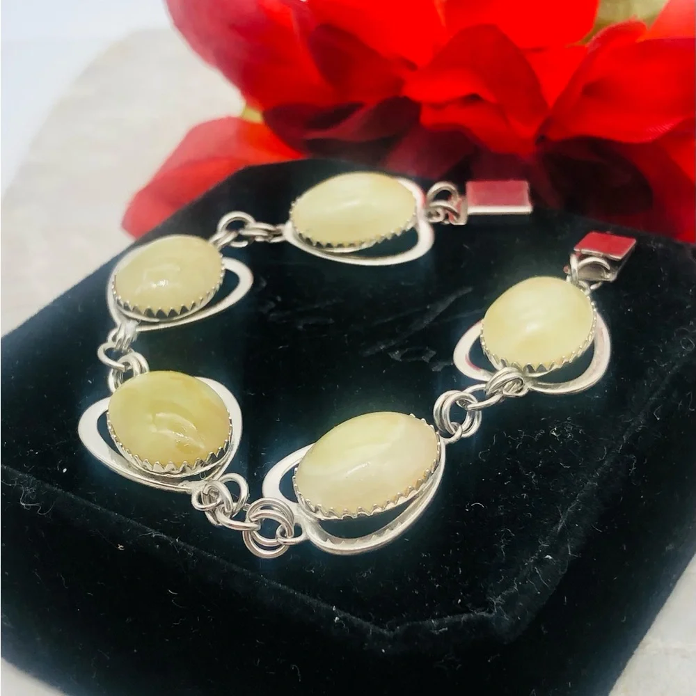 Rhodium Plated Bracelet with Pale Green Amber Cabochons